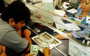 Report: Migrants’ Remittances Drain $150 Billion a Year from Economy